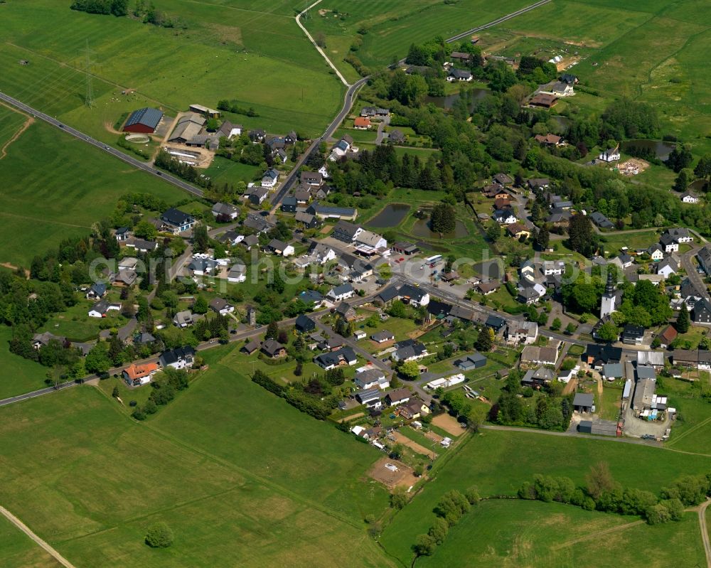 Rennerod from the bird's eye view: View of the Emmerichenhain part of the town of Rennerod in the state of Rhineland-Palatinate. The town is located in the Westerwald region and county district on federal highway B54. It is surrounded by industrial areas, agricultural fields and meadows. Emmerichenhain is located in the North of the core town