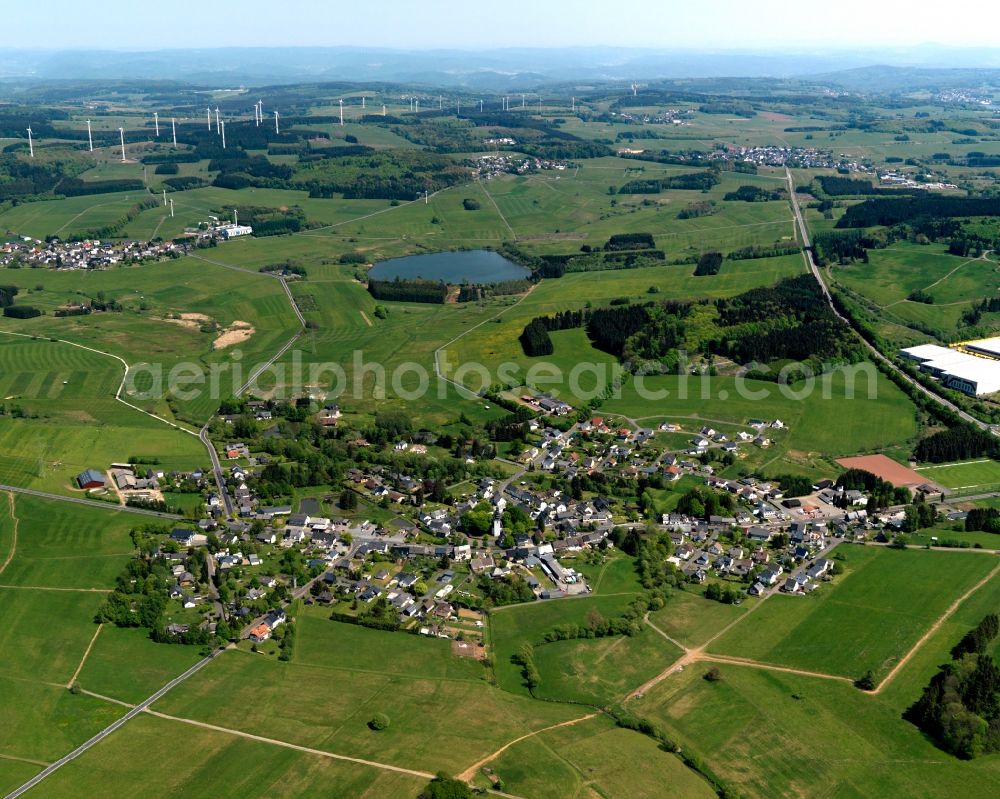 Aerial image Rennerod - View of the Emmerichenhain part of the town of Rennerod in the state of Rhineland-Palatinate. The town is located in the Westerwald region and county district on federal highway B54. It is surrounded by industrial areas, agricultural fields and meadows. Emmerichenhain is located in the North of the core town