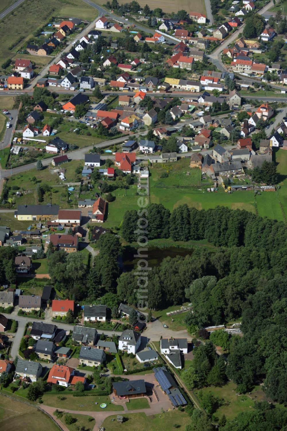 Aerial image Gräfenhainichen - View of the Tornau part of the town of Graefenhainichen in the state of Saxony-Anhalt. The village is located on federal highway B2 in the county district of Wittenberg and consists of single family houses and farms