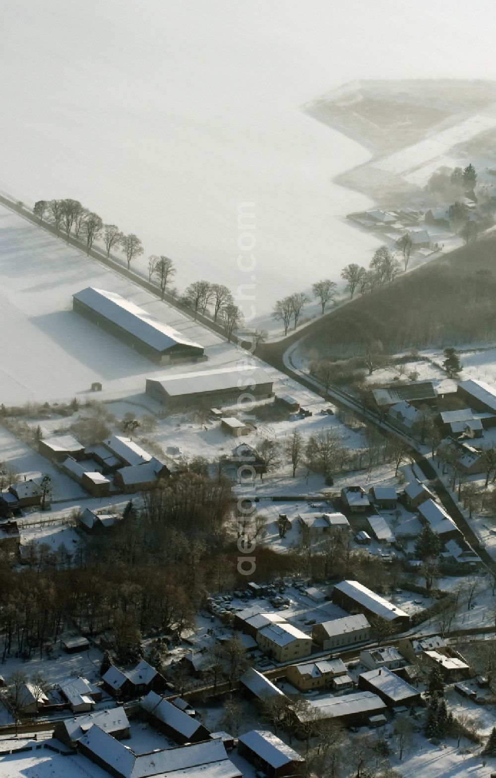 Altlandsberg from above - View of the winterly and snow covered village of Wegendorf in Altlandsberg in the state of Brandenburg