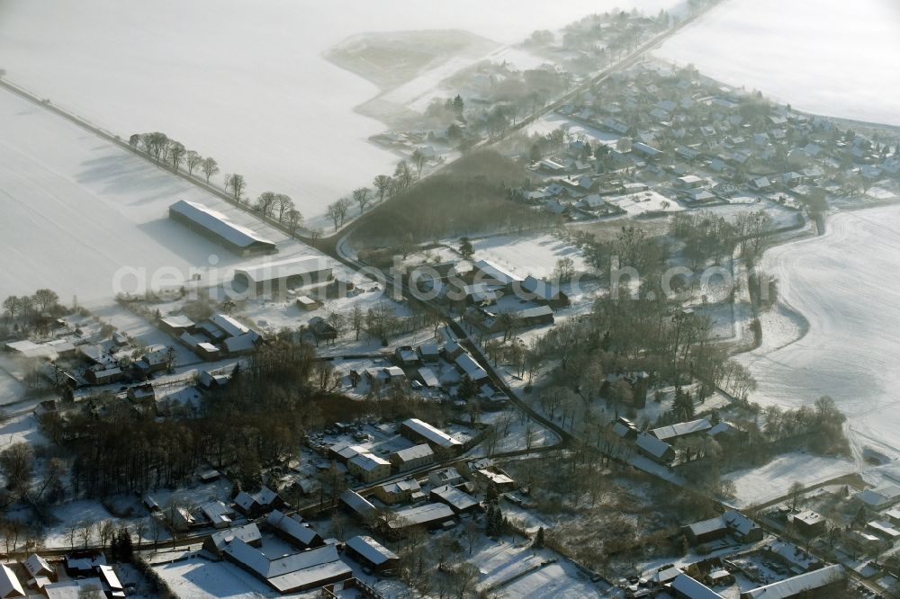 Aerial image Altlandsberg - View of the winterly and snow covered village of Wegendorf in Altlandsberg in the state of Brandenburg