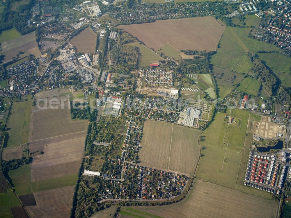 Aerial image Teltow - View of residential areas, allotments and commercial areas in Ruhlsdorf in the state of Brandenburg. The rural area is surrounded by agricultural fields