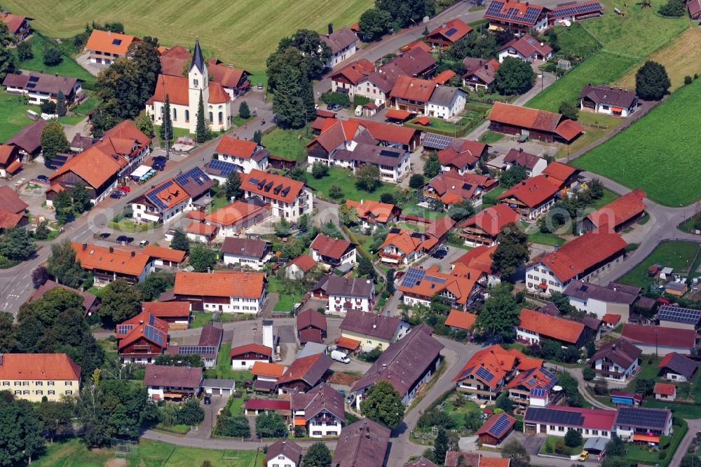 Sindelsdorf from the bird's eye view: Church building in the village of in Sindelsdorf in the state Bavaria