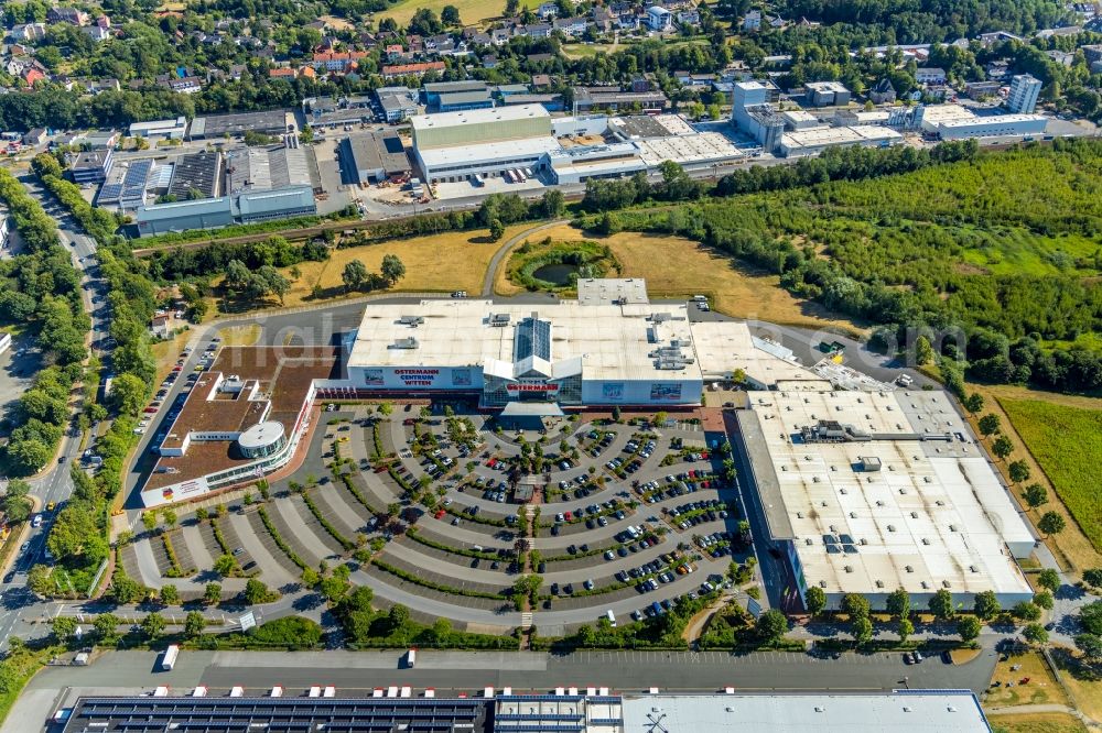 Aerial photograph Witten - OSTERMANN Einrichtungs-Centrum Witten on Fredi-Ostermann-Strasse with parking and storage space for automobiles in Witten in the state North Rhine-Westphalia