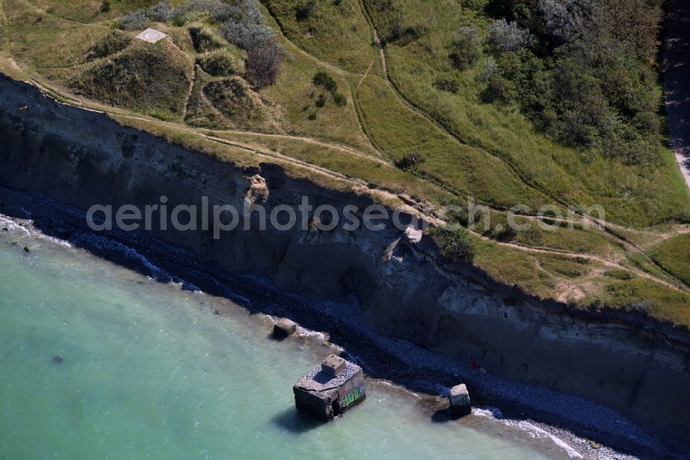 Wustrow from the bird's eye view: Coastline at the rocky cliffs of Ruins of the old bunker plant in Wustrow in the state Mecklenburg - Western Pomerania