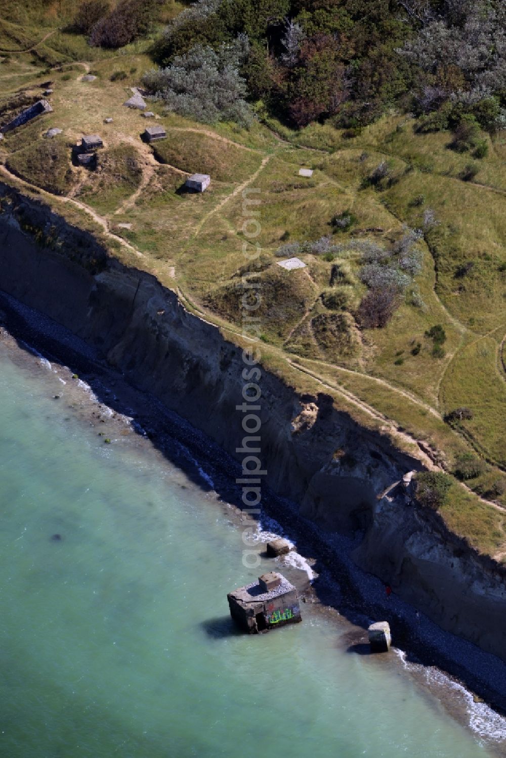 Aerial image Wustrow - Coastline at the rocky cliffs of Ruins of the old bunker plant in Wustrow in the state Mecklenburg - Western Pomerania