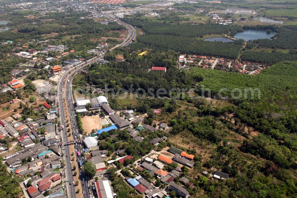 Si Sunthon from above - Palm-bordered road 402 at Mu Ban Charoen Suk at Si Sunthon on the island of Phuket in Thailand