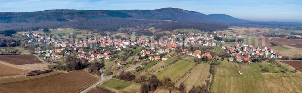 Lampertsloch from the bird's eye view: Panoramic perspective Village - view on the edge of agricultural fields and farmland in Lampertsloch in Grand Est, France