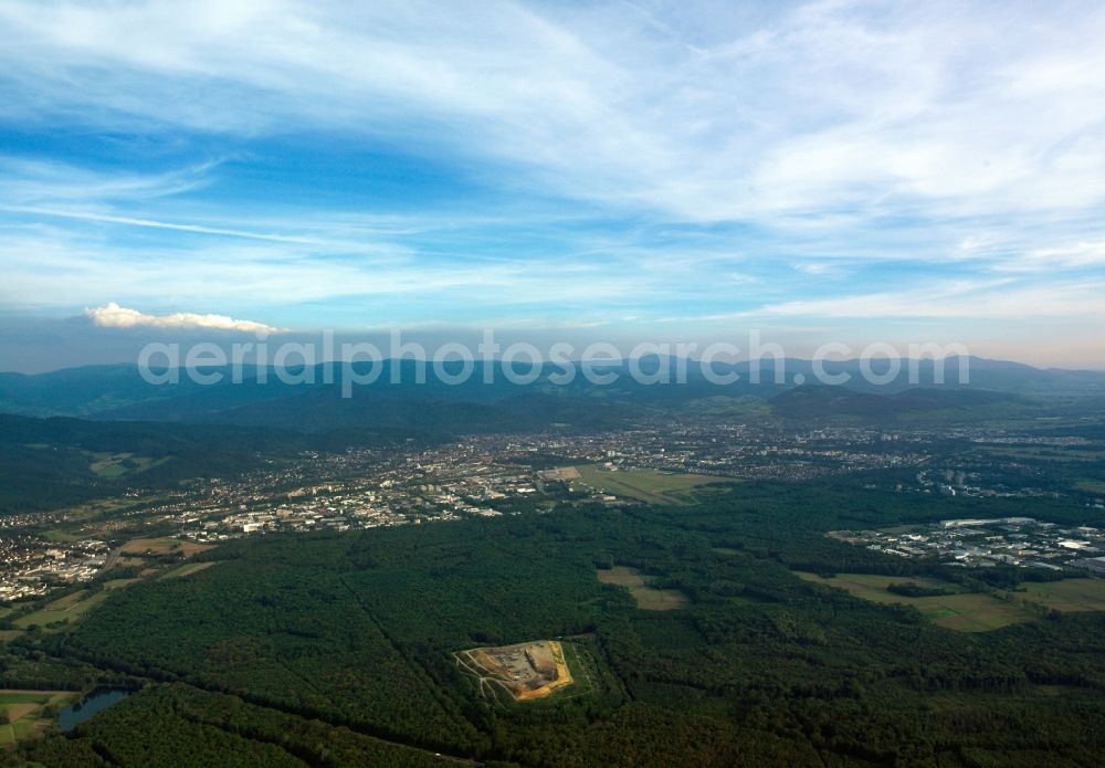 Aerial image Freiburg im Breisgau - Panoramic view and landscape of the Black Forest around Freiburg in the state of Baden-Wuerttemberg. Behind Germany's southern most metropolitan area, the landscapes of the Breisgau region and the Black Forest are visible. Hills and mountains are standing in fog and mist