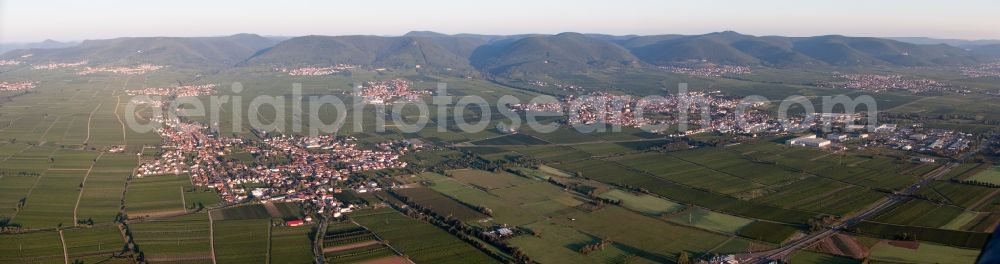 Edenkoben from the bird's eye view: Panoramic perspective Town View of the streets and houses of the residential areas in Edesheim and Edenkoben in the state Rhineland-Palatinate