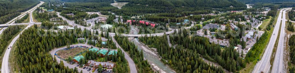 Aerial image Lake Louise - Panoramic perspective city view of the inner city area in the valley surrounded by mountains Lake Louise on street Village Road in Lake Louise in Alberta, Canada