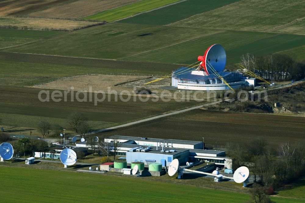 Raisting from the bird's eye view: Parbola antennas in the form of white satellite dishes on the site of the earth station Erdfunkstelle in Raisting at Weilheimer Land in the state Bavaria, Germany