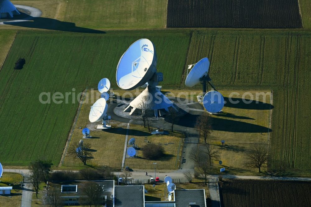 Raisting from the bird's eye view: Parbola antennas in the form of white satellite dishes on the site of the earth station Erdfunkstelle in Raisting at Weilheimer Land in the state Bavaria, Germany