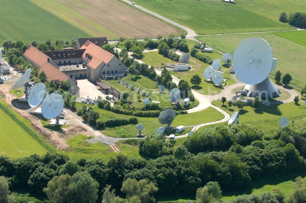 Fuchsstadt from above - Parbola antennas in the form of white satellite dishes on the site of the earth station in Fuchsstadt in the state Bavaria, Germany