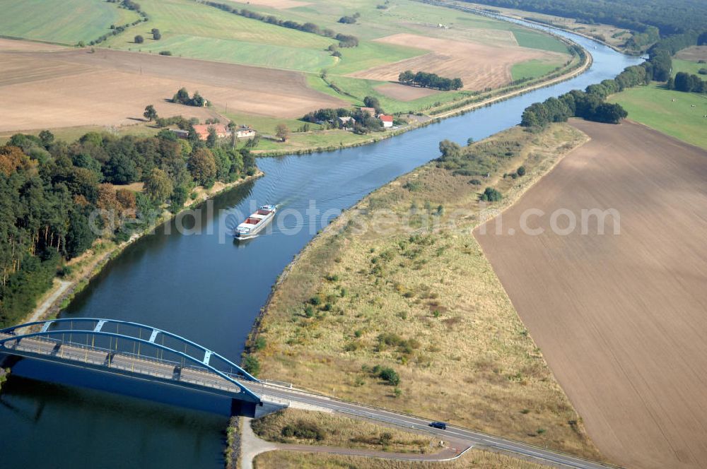 Aerial photograph Parchau - Blick auf Schiffsverkehr an der Parchauer Straßenbrücke. Ein Schiff / Lastkahn fährt auf dem EHK. Die Brücke wurde im Jahr 2002 erbaut und überführt den Elbe-Havel-Kanal bei km 337,182. Ein Projekt des WSV: Wasserstraßen-Neubauamt Magdeburg, 39106 Magdeburg, Tel. +49(0)391 535-0, email: wna-magdeburg@wsv.bund.de