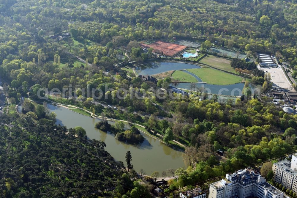 Paris from the bird's eye view: Park of Bois de Boulogne with sports grounds and facilities in the West of the city center of Paris in Ile-de-France, France