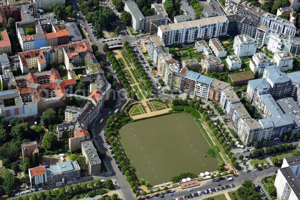 Berlin from above - View of the Angel's Basin in Kreuzberg. The angel is on the bottom of the pool Luisenstädtischer channel ahead of Michael's Church, between Leuschnerdamm and Legiendamm. Until 1989 it was filled with debris of war. Today it is an urban park with rose garden