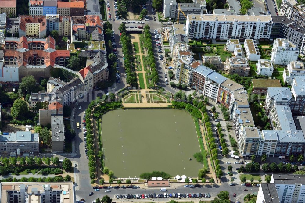 Berlin from the bird's eye view: View of the Angel's Basin in Kreuzberg. The angel is on the bottom of the pool Luisenstädtischer channel ahead of Michael's Church, between Leuschnerdamm and Legiendamm. Until 1989 it was filled with debris of war. Today it is an urban park with rose garden