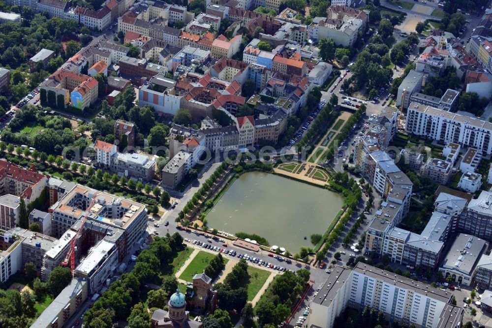 Berlin from the bird's eye view: View of the Angel's Basin in Kreuzberg. The angel is on the bottom of the pool Luisenstädtischer channel ahead of Michael's Church, between Leuschnerdamm and Legiendamm. Until 1989 it was filled with debris of war. Today it is an urban park with rose garden