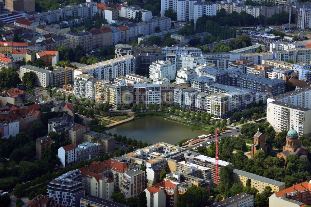 Berlin from above - View of the Angel's Basin in Kreuzberg. The angel is on the bottom of the pool Luisenstädtischer channel ahead of Michael's Church, between Leuschnerdamm and Legiendamm. Until 1989 it was filled with debris of war. Today it is an urban park with rose garden