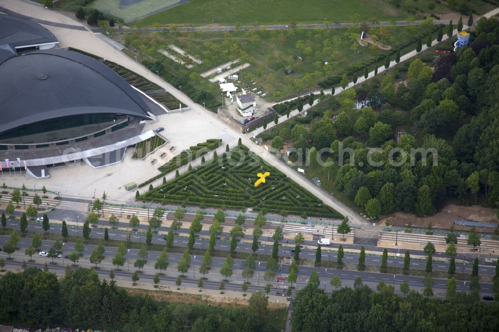 Aerial image Luxembourg Luxemburg - Park in the form of a hedge labyrinth in Luxembourg in District de Luxembourg, Luxembourg. The sculpture in the form of a yellow staircase is called Dendrite. It is a work of the Canadian artist Michel de Broin