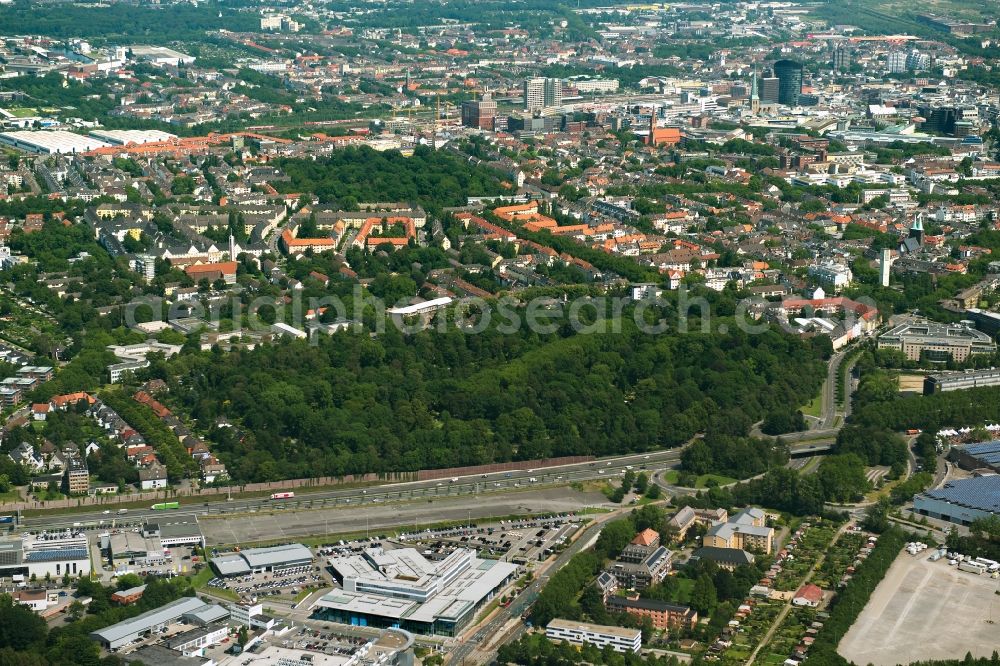 Aerial image Dortmund - Park of Suedwestfriedhof beneath the motorway A40 aswell as surrounding residential areas in Dortmund in the state North Rhine-Westphalia