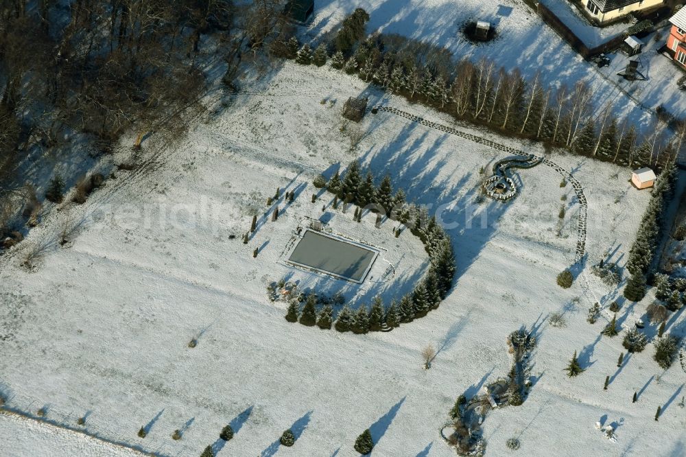 Ludwigsfelde from the bird's eye view: Wintry snowy Park on Wiesenstrasse in Wietstock in the state Brandenburg