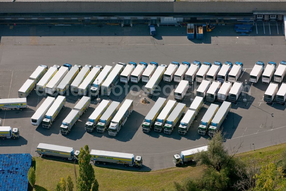 Meckenheim from the bird's eye view: View of the truck parking in front of the EDEKA warehouse in Meckenheim in North Rhine-Westphalia. The camp pimarily serves as a logistics center