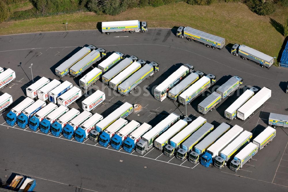 Aerial photograph Meckenheim - View of the truck parking in front of the EDEKA warehouse in Meckenheim in North Rhine-Westphalia. The camp pimarily serves as a logistics center