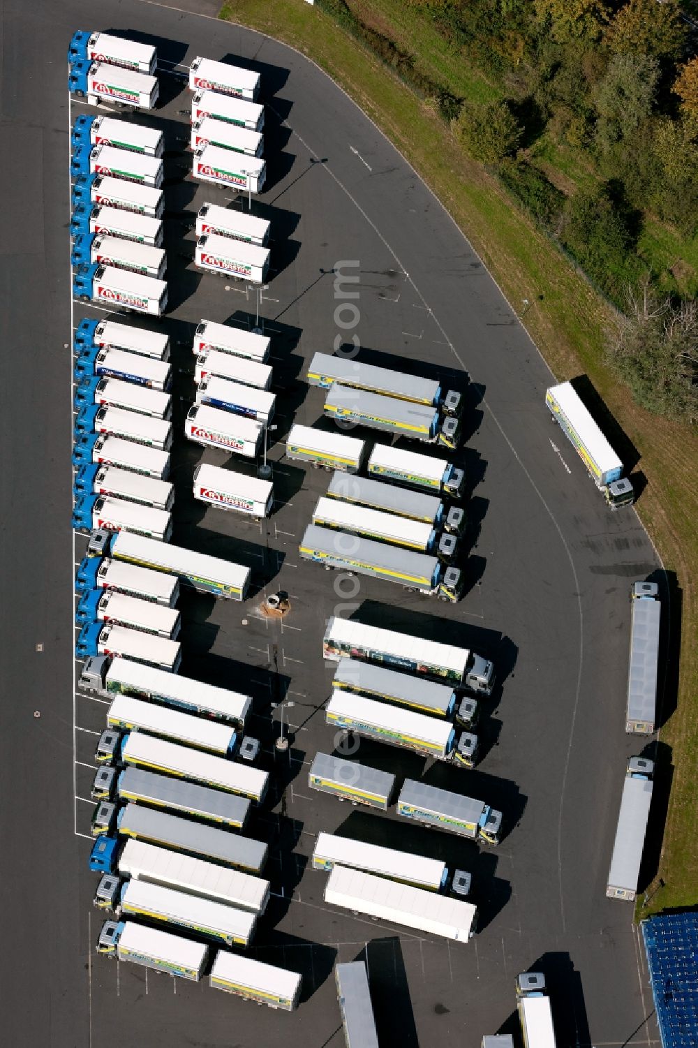 Meckenheim from the bird's eye view: View of the truck parking in front of the EDEKA warehouse in Meckenheim in North Rhine-Westphalia. The camp pimarily serves as a logistics center