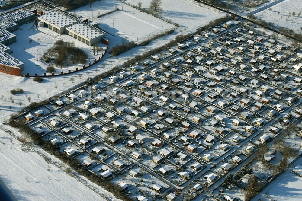 Berlin from above - Winterly snowy parcel of the small garden area 750 Jahre Berlin e.V. in Berlin in Germany