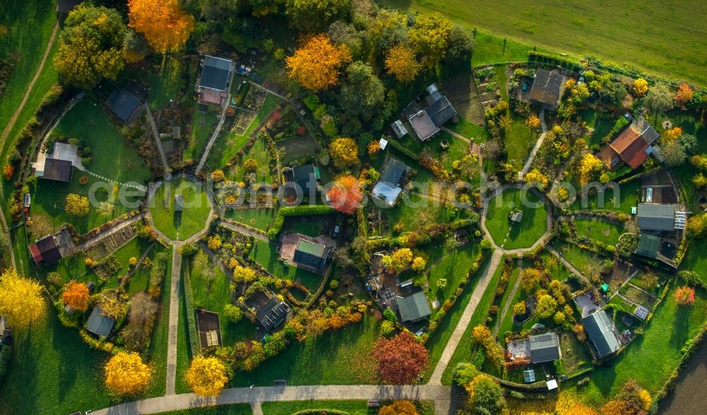 Aerial photograph Stockum - Parcels of a circular allotements in Stockum in the state of North Rhine-Westphalia. The colourful parcels are located in a circle around central squares