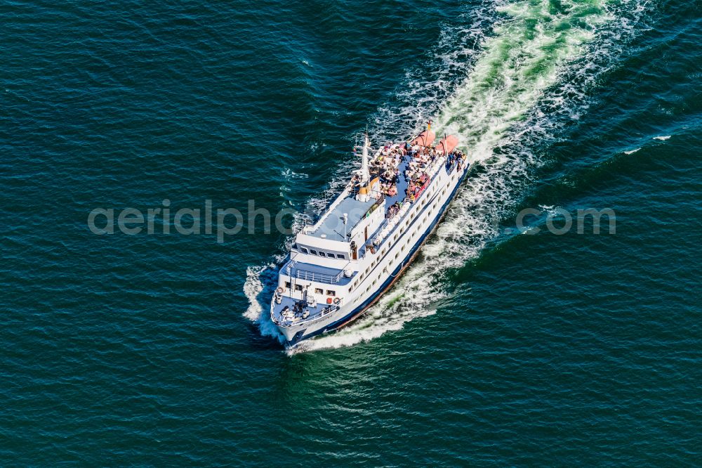 Aerial photograph Sassnitz - Passenger ship CAP ARKONA in port on street Strandpromenade in Sassnitz at the baltic sea coast in the state Mecklenburg - Western Pomerania, Germany