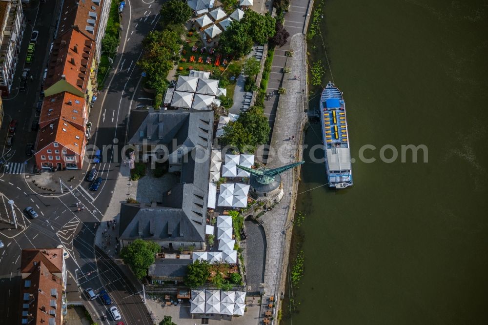 Würzburg from the bird's eye view: Passenger ship in front of the gastronomy - restaurant - building with the Brauerei-Gasthof Alter Kranen in the district Altstadt in Wuerzburg in the state Bavaria, Germany