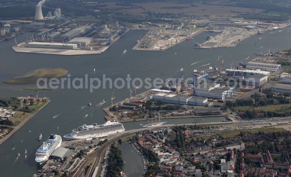 Aerial image Rostock - Passenger ship Marina und NORWEGIAN SUN in Rostock, Warnemuende in the state Mecklenburg - Western Pomerania. In the background, the halls and buildings with Kai - plants of Warnow - shipyard, today Neptun Werft