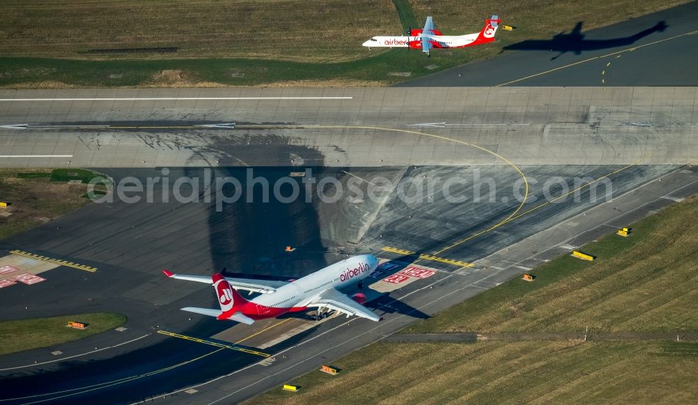 Düsseldorf from above - Airliner- Passenger aircraft von Air Berlin rolling on the apron of the airport in the district Stadtbezirk 5 in Duesseldorf in the state North Rhine-Westphalia