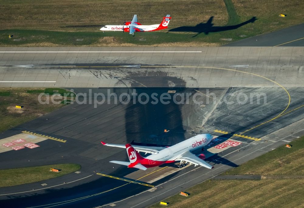 Düsseldorf from the bird's eye view: Airliner- Passenger aircraft von Air Berlin rolling on the apron of the airport in the district Stadtbezirk 5 in Duesseldorf in the state North Rhine-Westphalia