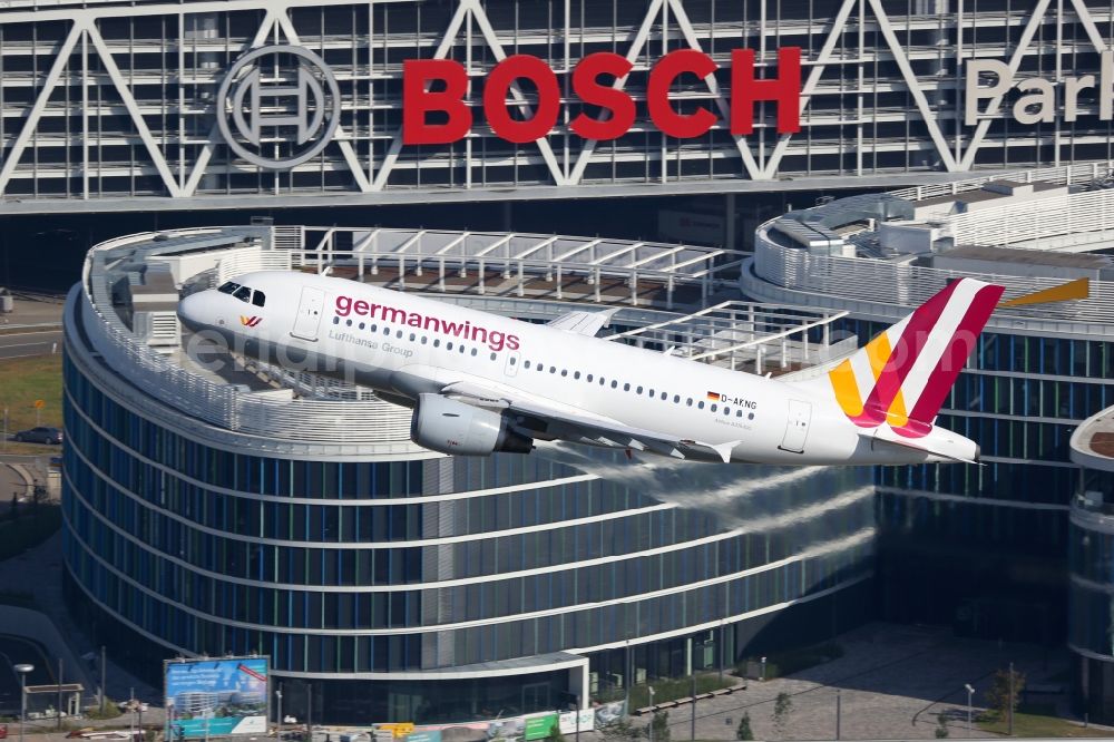 Aerial photograph Stuttgart - Passenger aircraft Airbus A319-100 of the airline germanwings at the start over the airport in Stuttgart in the state of Baden-Wuerttemberg