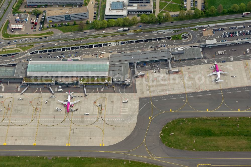 Holzwickede from the bird's eye view: Passenger airplane Airbus A320 in parking position - parking area at the airport in Holzwickede in the state North Rhine-Westphalia, Germany