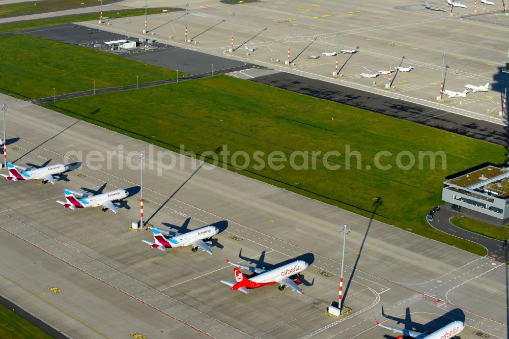 Aerial image Schönefeld - Airliner- Passenger aircraft AIRBUS A319 - 320 of insolvent airline airberlin on the apron of the airport BER in Schoenefeld in the state Brandenburg, Germany