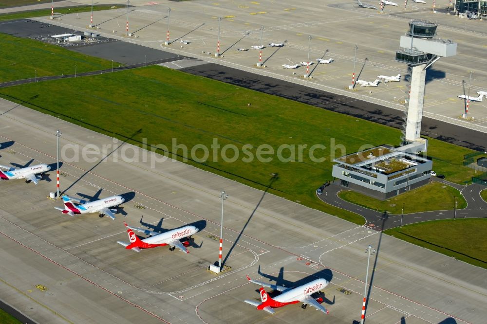 Aerial photograph Schönefeld - Airliner- Passenger aircraft AIRBUS A319 - 320 of insolvent airline airberlin on the apron of the airport BER in Schoenefeld in the state Brandenburg, Germany