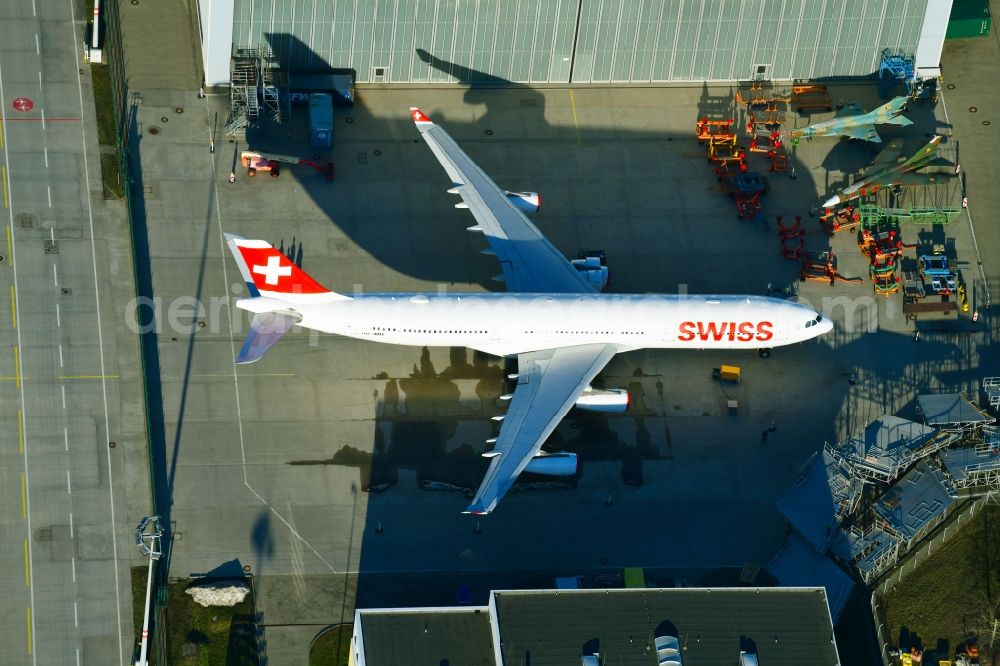 Dresden from the bird's eye view: Passenger airplane Airbus A340-313 of Swiss with the callsign HB-JMH in parking position - parking area at the airport in the district Klotzsche in Dresden in the state Saxony, Germany