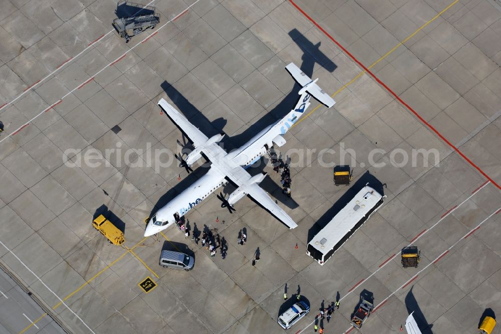 Stuttgart from the bird's eye view: Airliner Bombardier Dash Q400 of airline fly be on the airport in Stuttgart in the state Baden-Wuerttemberg