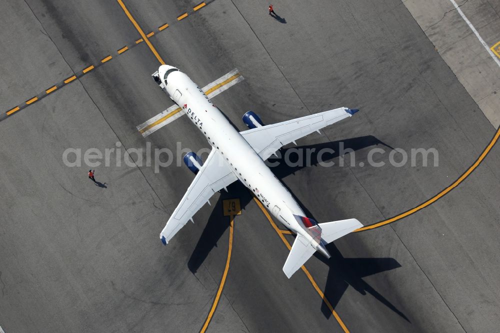 Los Angeles from above - Passenger Airplane Embraer ERJ-175LR from the airline Delta Air Lines at the airport in Los Angeles in California, USA