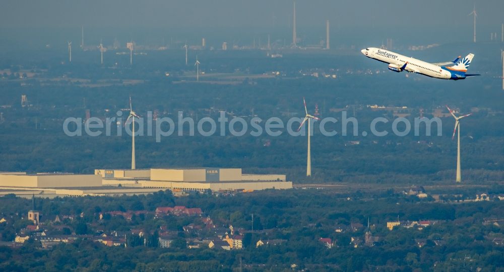 Aerial photograph Dortmund - Passenger craft of the Sunexpress airline after the start of Dortmund airport on the fly over the airspace in Dortmund in the state North Rhine-Westphalia