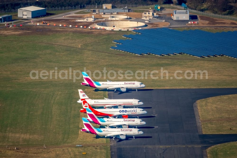 Düsseldorf from the bird's eye view: Passenger airplane of insolventen airberlin - eurowings in parking position - parking area at the airport in the district Lichtenbroich in Duesseldorf in the state North Rhine-Westphalia, Germany