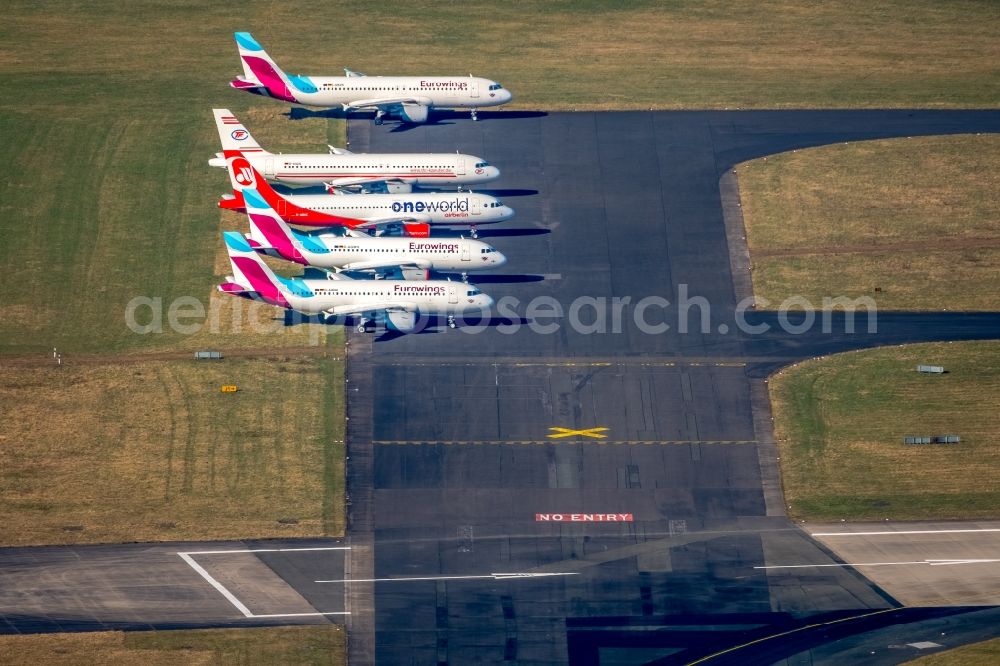 Aerial image Düsseldorf - Passenger airplane of insolventen airberlin - eurowings in parking position - parking area at the airport in the district Lichtenbroich in Duesseldorf in the state North Rhine-Westphalia, Germany