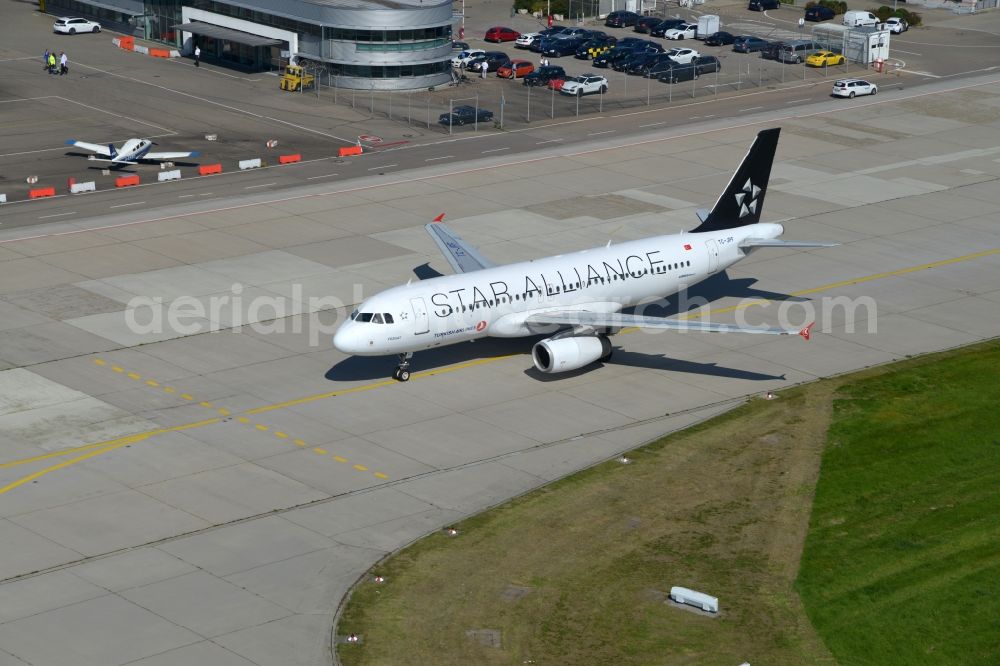 Aerial image Stuttgart - Airliner- Passenger aircraft TC-JPF - Airbus A320-232 - Turkish Airlines Star Alliance Livery rolling on the apron of the airport in Stuttgart in the state Baden-Wuerttemberg