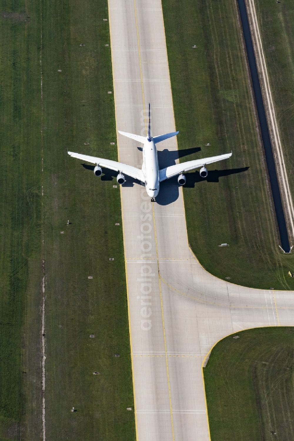 Aerial image München - Airliner- Passenger aircraft A 380 of Lufthansa rolling on the apron of the airport in Munich in the state Bavaria, Germany