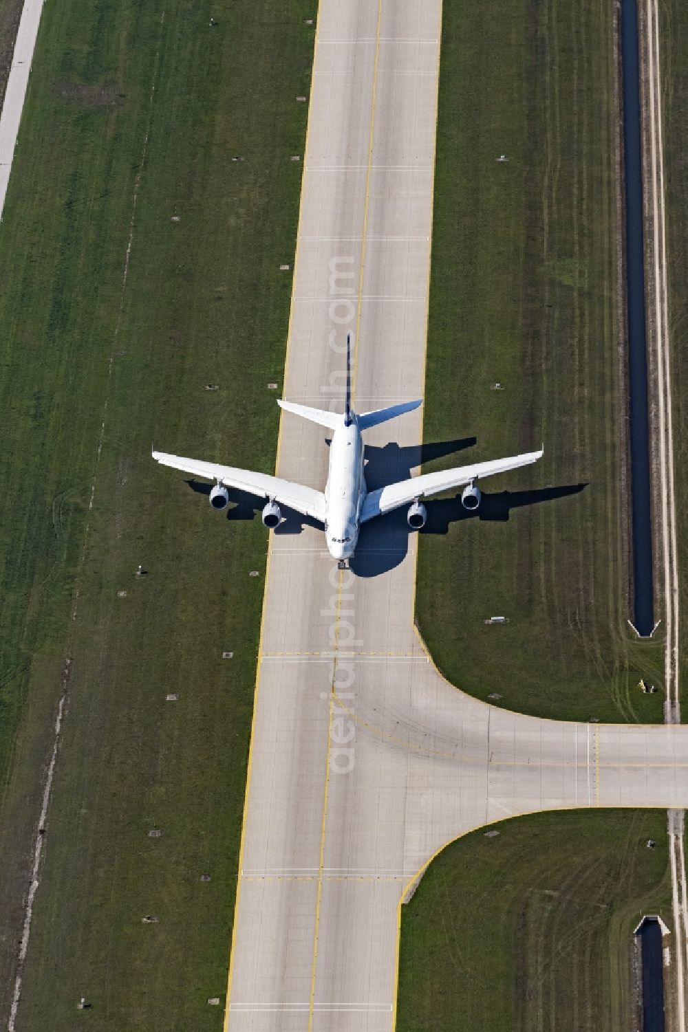 Aerial photograph München - Airliner- Passenger aircraft A 380 of Lufthansa rolling on the apron of the airport in Munich in the state Bavaria, Germany